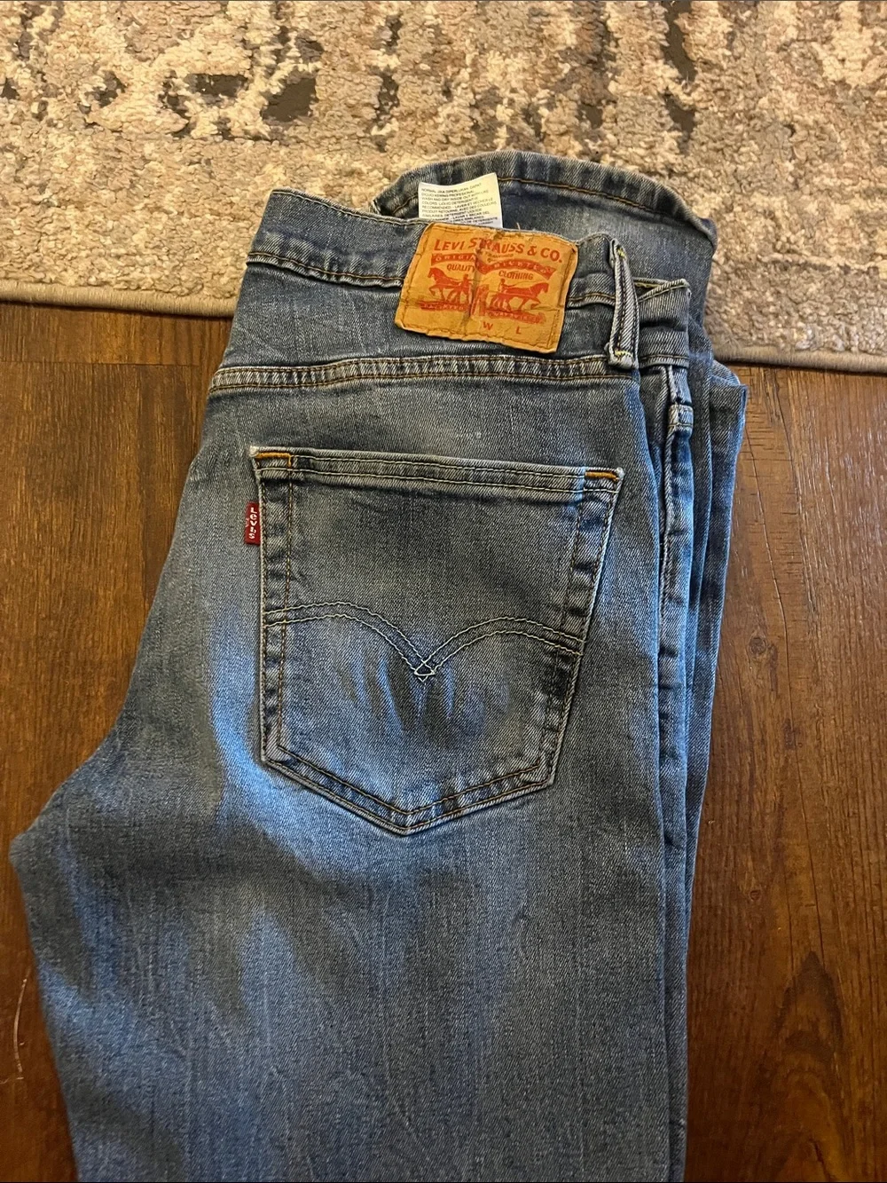 Levi's Straight Leg Jeans in Light Blue Denim with Tan Leather Patch